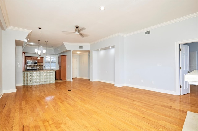 unfurnished living room featuring light hardwood / wood-style floors, ceiling fan, and ornamental molding