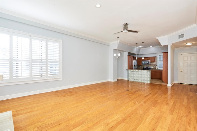 unfurnished living room with light hardwood / wood-style flooring, ceiling fan, and ornamental molding