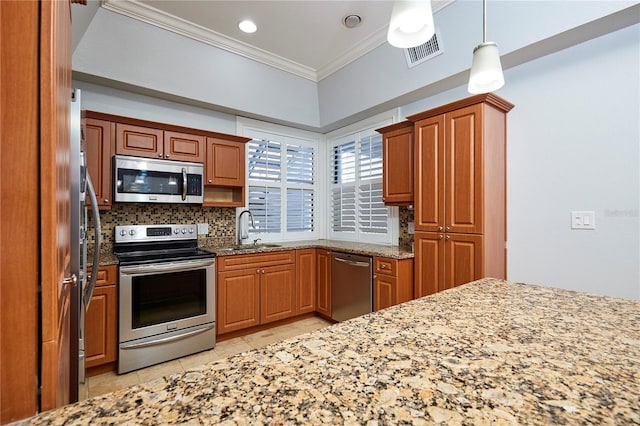 kitchen with appliances with stainless steel finishes, backsplash, light stone counters, ornamental molding, and sink