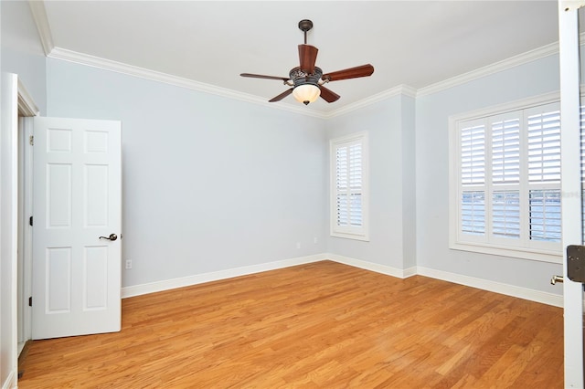 empty room featuring ceiling fan, crown molding, and light hardwood / wood-style flooring