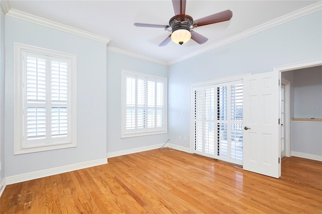 unfurnished bedroom featuring access to exterior, ceiling fan, crown molding, and light wood-type flooring