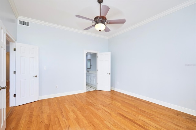 empty room with light hardwood / wood-style flooring, ceiling fan, and ornamental molding