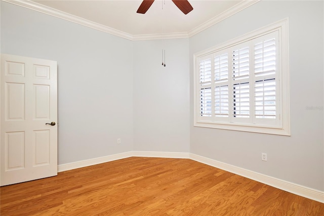 unfurnished room featuring hardwood / wood-style flooring, ceiling fan, and crown molding