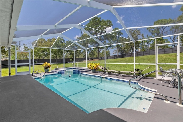 view of pool featuring a lanai, a yard, a patio, and an in ground hot tub