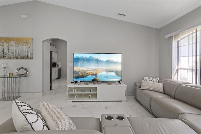 living room with lofted ceiling