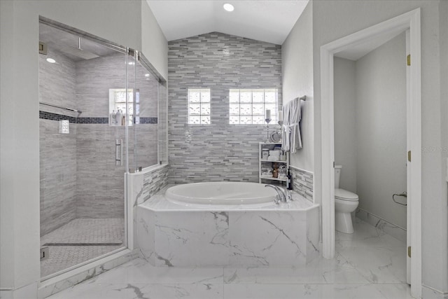 bathroom featuring separate shower and tub, vaulted ceiling, and toilet