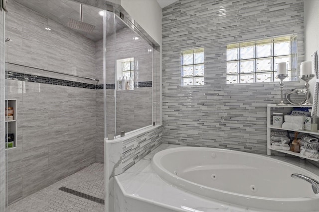 bathroom with shower with separate bathtub