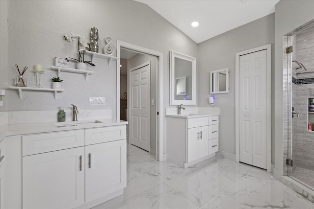 bathroom with vanity, an enclosed shower, and vaulted ceiling