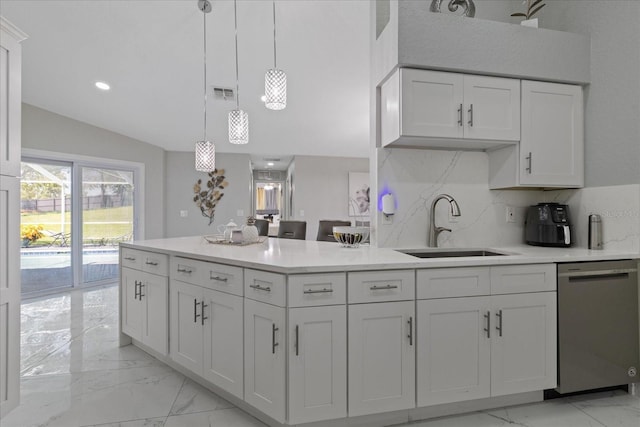 kitchen featuring backsplash, sink, decorative light fixtures, dishwasher, and white cabinetry