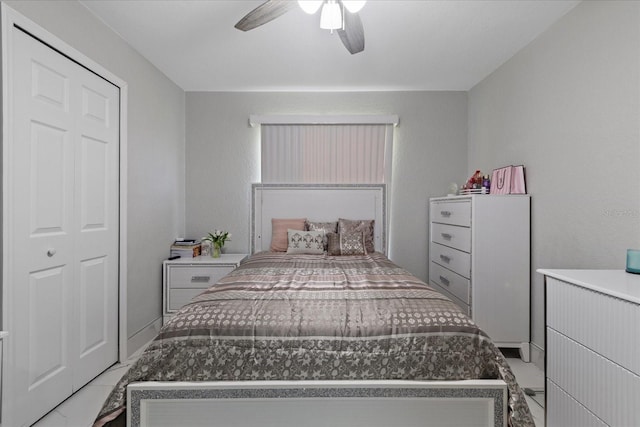 bedroom featuring ceiling fan and a closet