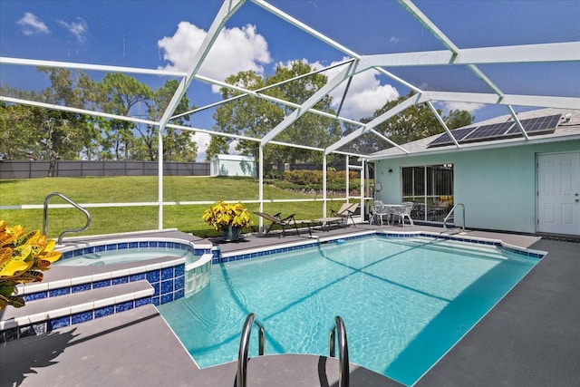 view of swimming pool with an in ground hot tub, a yard, a patio, and a lanai