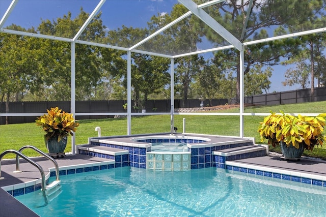 view of swimming pool with an in ground hot tub, a lanai, and a lawn