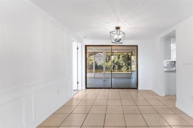 interior space with an inviting chandelier and light tile patterned flooring