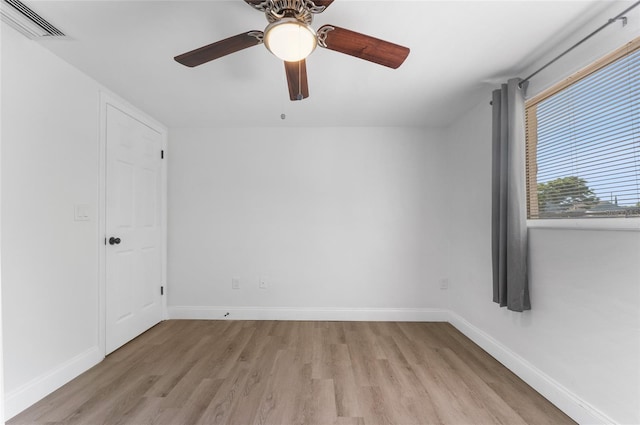 empty room featuring ceiling fan and light wood-type flooring