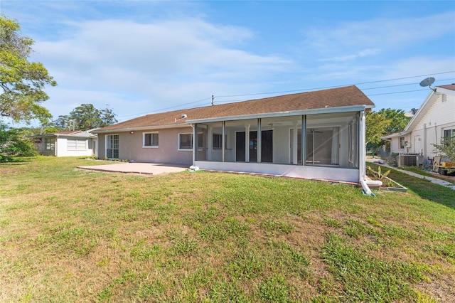 back of property featuring a yard, central AC, a patio area, and a sunroom