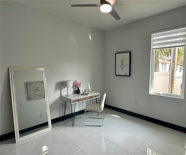 home office with ceiling fan and light tile patterned floors