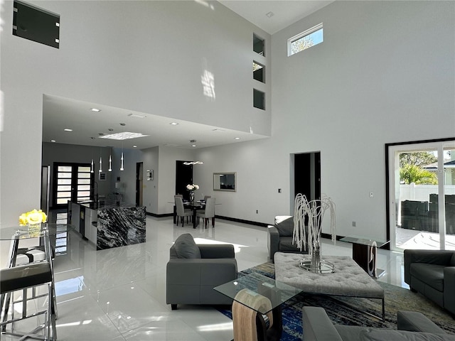 living room with a towering ceiling