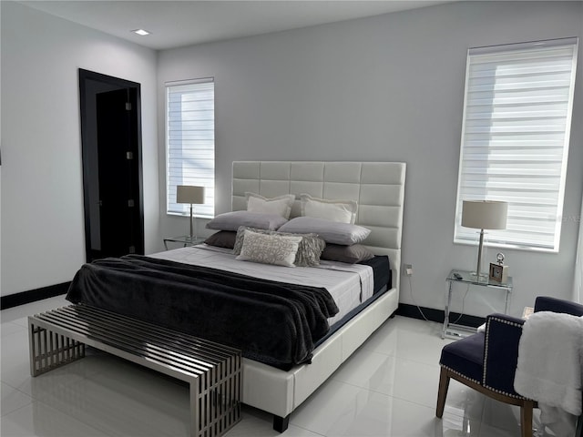 bedroom featuring light tile patterned floors