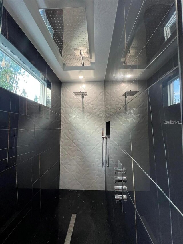 bathroom with a tile shower