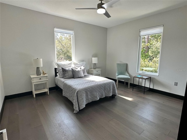 bedroom with ceiling fan and dark wood-type flooring