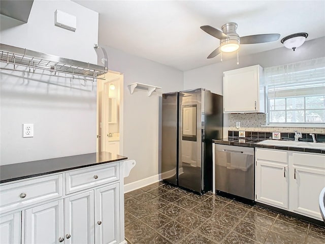 kitchen featuring backsplash, stainless steel appliances, ceiling fan, sink, and white cabinets