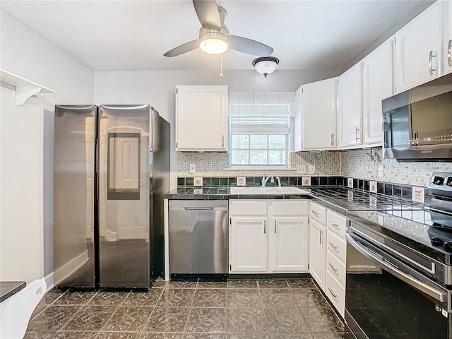 kitchen with ceiling fan, sink, white cabinets, and appliances with stainless steel finishes