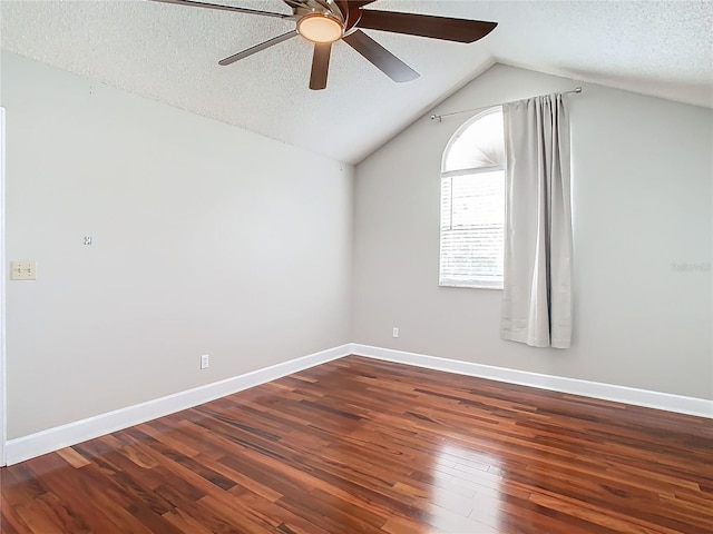 bonus room featuring dark hardwood / wood-style floors, ceiling fan, lofted ceiling, and a textured ceiling