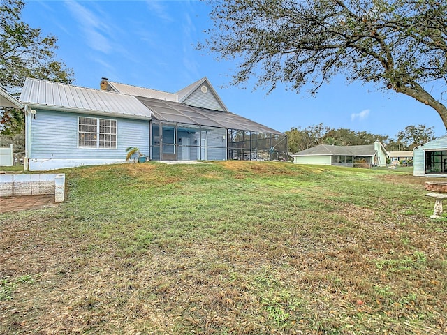 exterior space featuring a lanai and a lawn