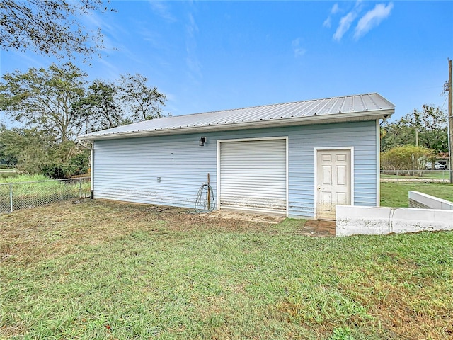 garage featuring a yard