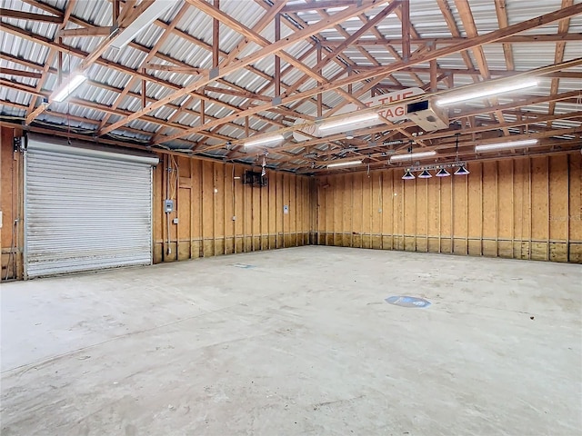 garage featuring wood walls