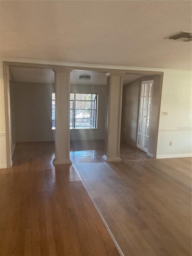 empty room with hardwood / wood-style floors