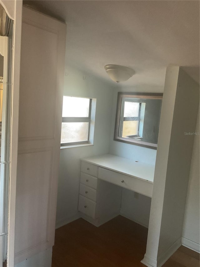 bathroom featuring vaulted ceiling and hardwood / wood-style flooring