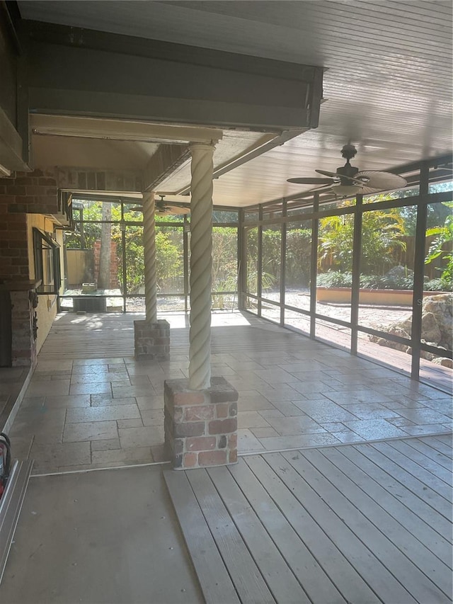 interior space with ceiling fan