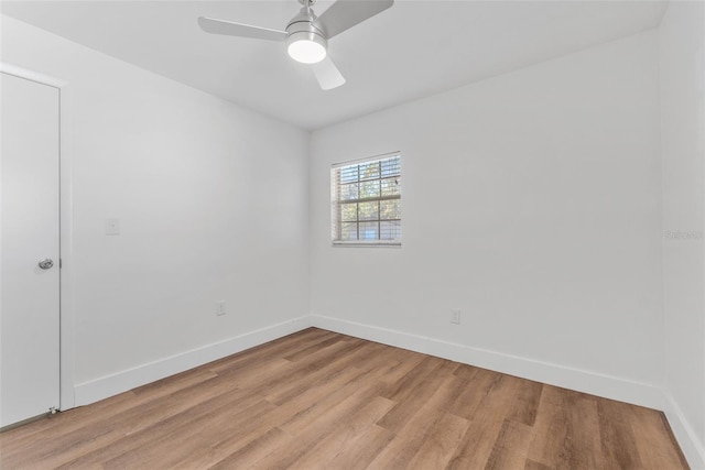 spare room featuring ceiling fan and light wood-type flooring