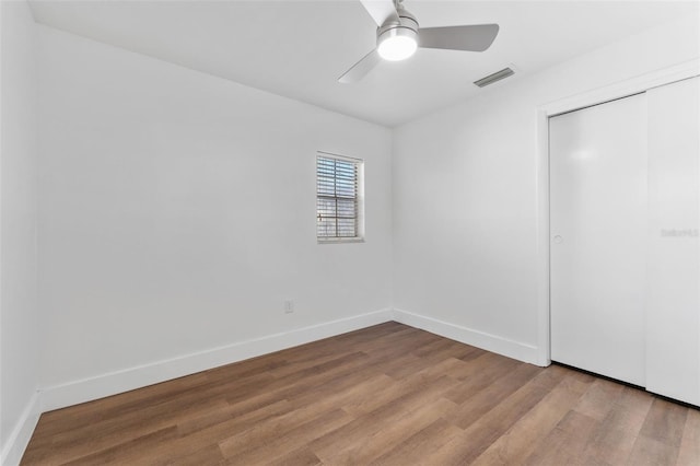 unfurnished bedroom with a closet, ceiling fan, and light hardwood / wood-style flooring