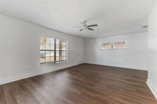 unfurnished room with ceiling fan, plenty of natural light, and dark hardwood / wood-style floors