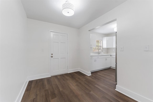 interior space with dark hardwood / wood-style floors and sink