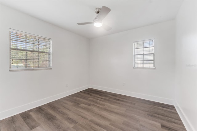 unfurnished room with dark wood-type flooring and ceiling fan