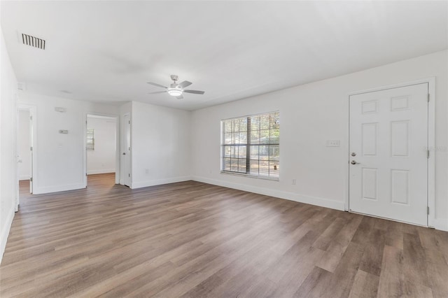 unfurnished living room with ceiling fan and light wood-type flooring