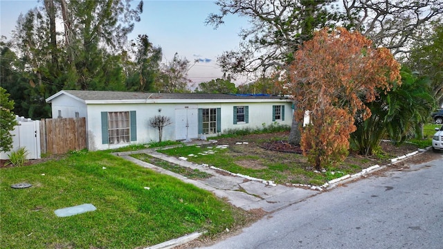 ranch-style house with a front yard