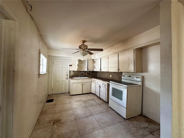 kitchen featuring ceiling fan, sink, electric stove, decorative backsplash, and light tile patterned floors