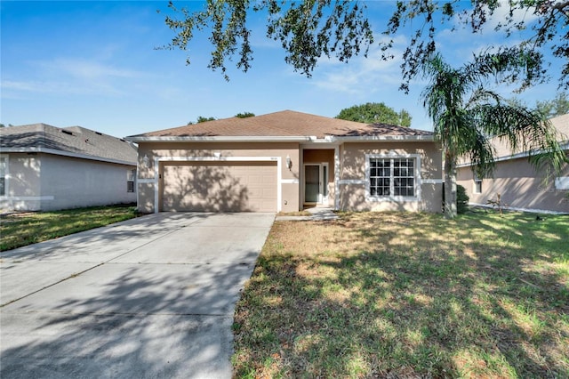 ranch-style house featuring a front lawn and a garage