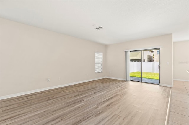 empty room with light wood-type flooring