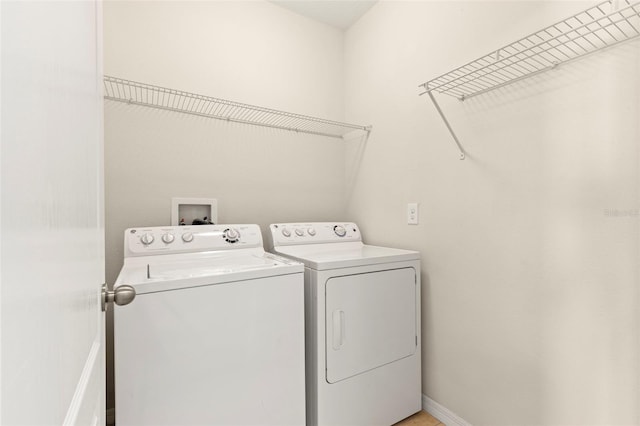 laundry area with separate washer and dryer