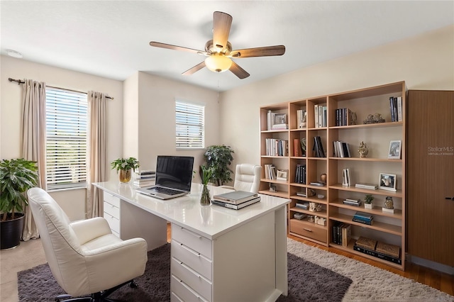 home office featuring ceiling fan and hardwood / wood-style floors