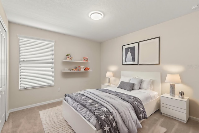 carpeted bedroom featuring a closet