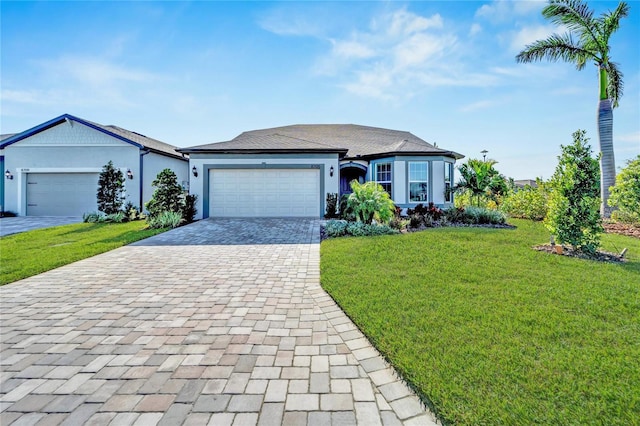 view of front facade with a front yard and a garage