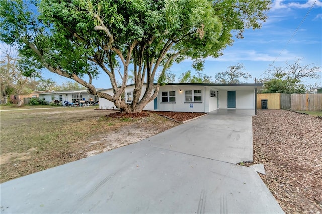 ranch-style home with a carport