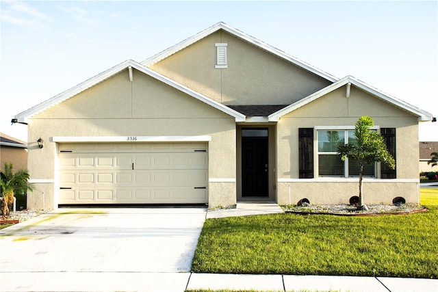 ranch-style house featuring a front yard and a garage