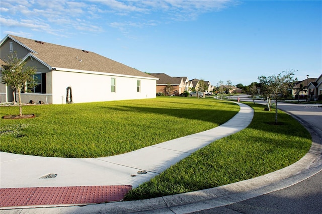 view of home's exterior featuring a yard